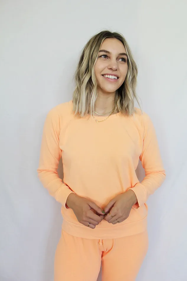 Womens Cotton Fleece Long Sleeve Raglan Pullover in Neon Orange Loungewear Chaser Brand